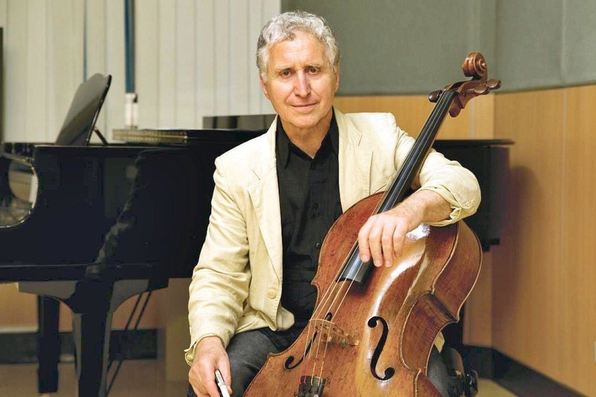 Yehuda Hanani sitting with Cello