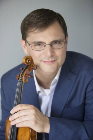 Ara Gregorian holding violin